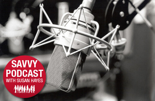 Studio microphone with the Savvy Podcast with Susan Hayes badge
